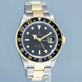 2000 PAPERS MINT Rolex GMT-Master II 16713 Black Two-Tone Yellow Gold Steel Watch