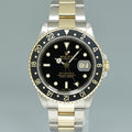 MINT 2000 Rolex GMT-Master 16713 Black Two-Tone Yellow Gold and Steel Oyster Watch
