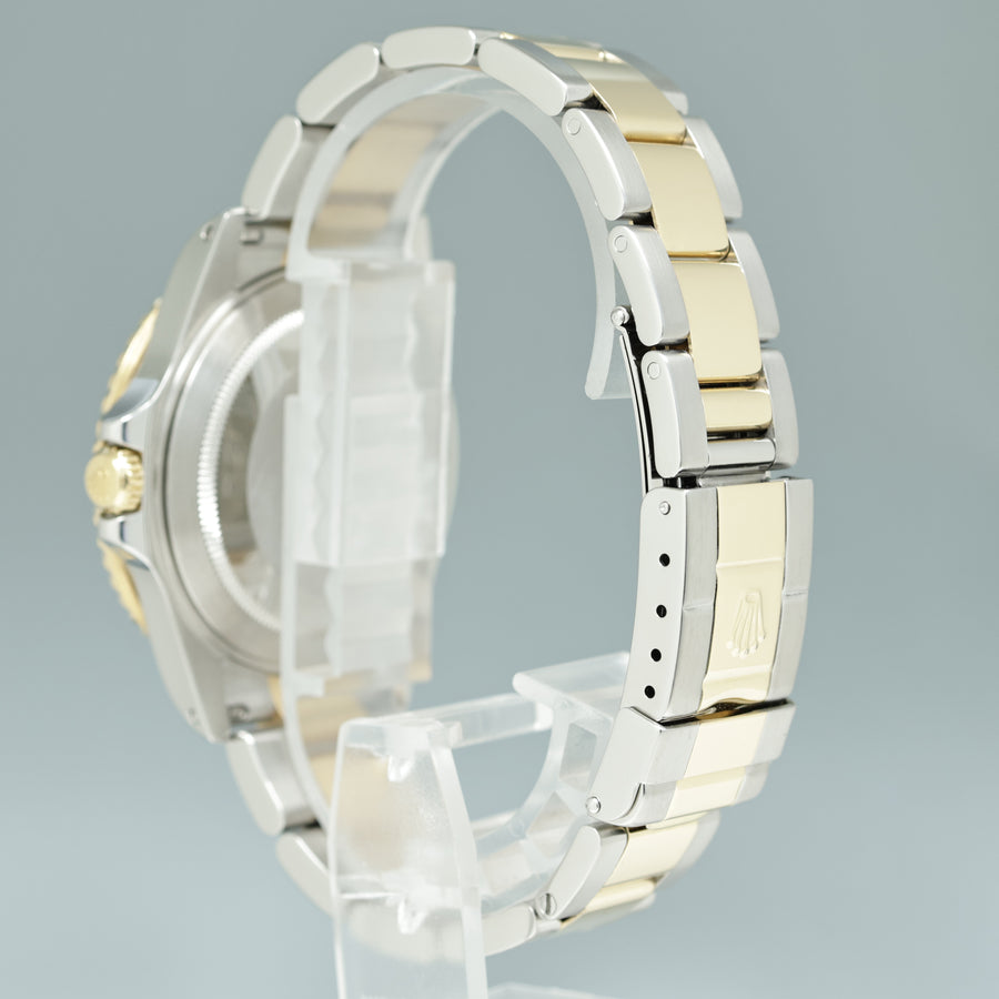 MINT 2000 Rolex GMT-Master 16713 Black Two-Tone Yellow Gold and Steel Oyster Watch