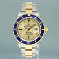MINT PAPERS Rolex Submariner 16613 Two Tone Gold Blue Champagne Serti Diamond Watch